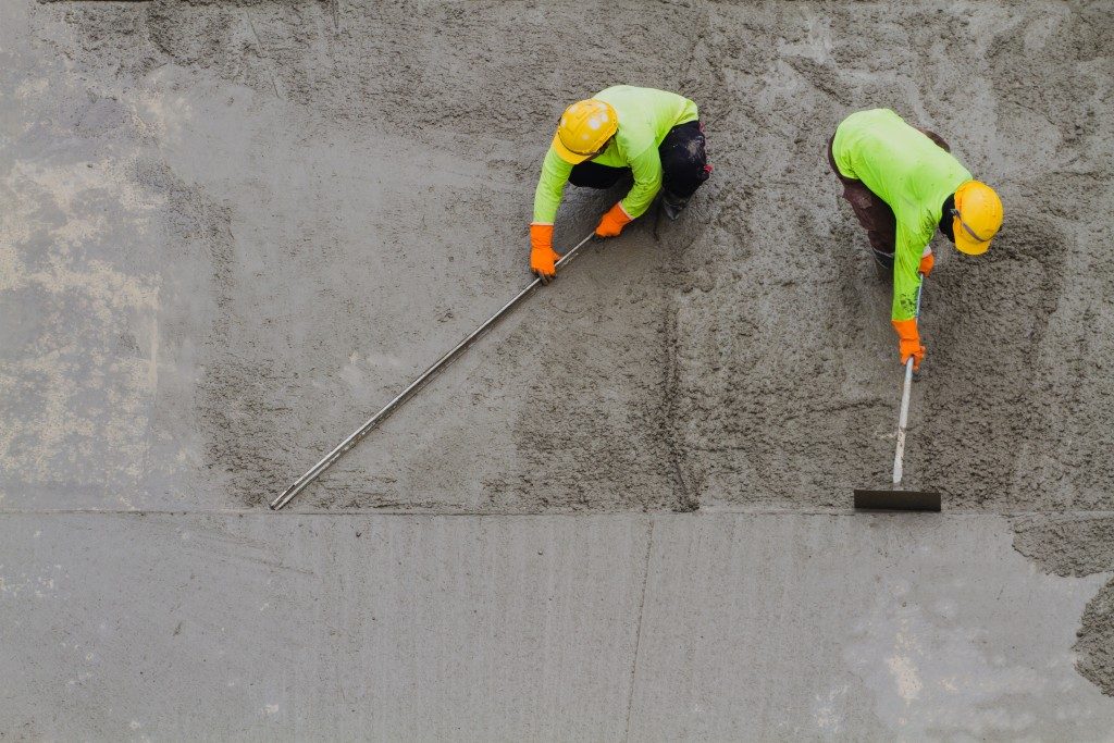 engineer leveling the cement