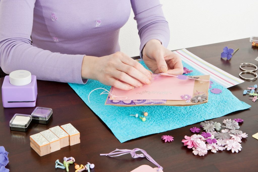 woman making scrapbook