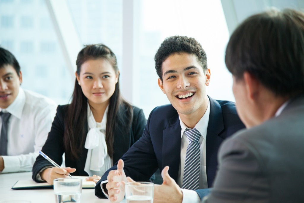 Close up of employees in a business meeting