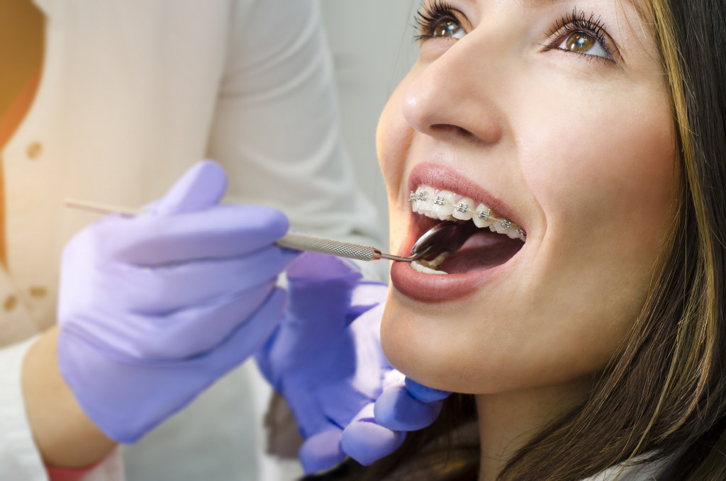 girl on dental braces check up