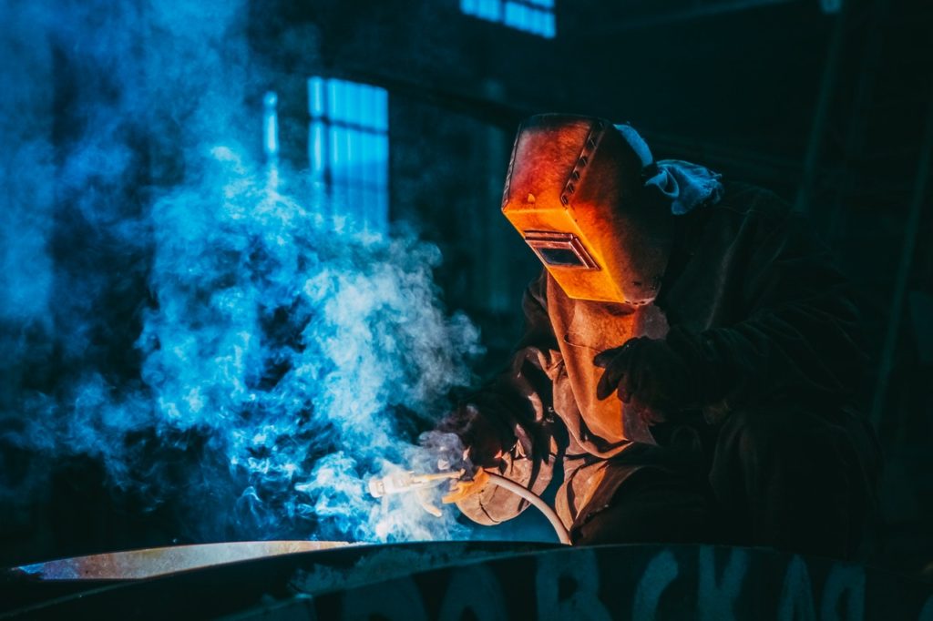 man welding