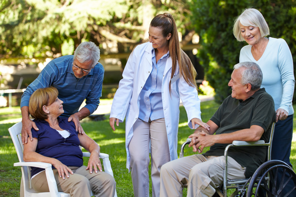 a physician visiting senior patients 