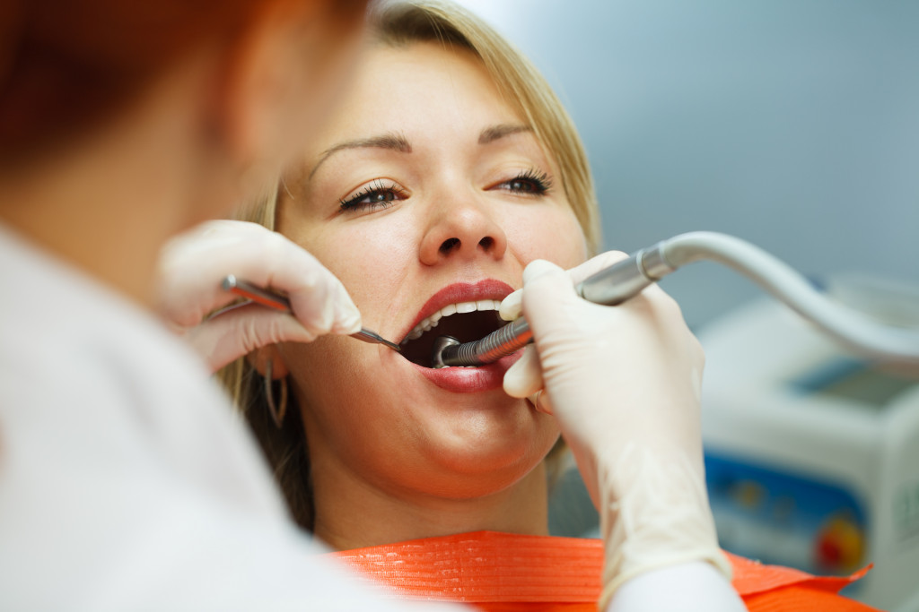 dentist checking a womans mouth