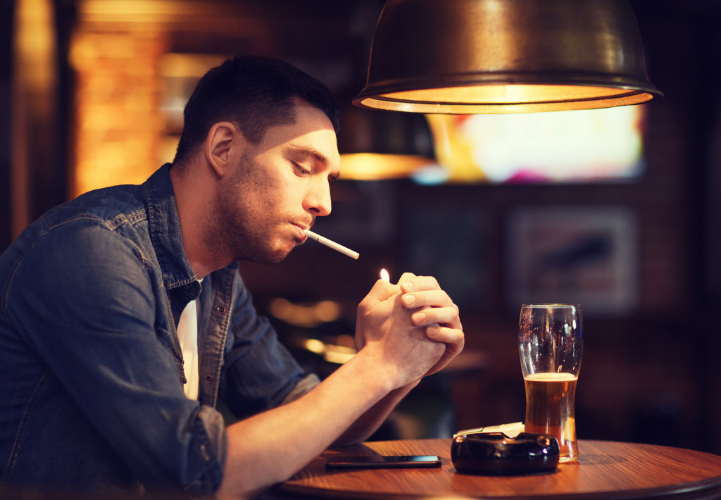 Man smoking in pub