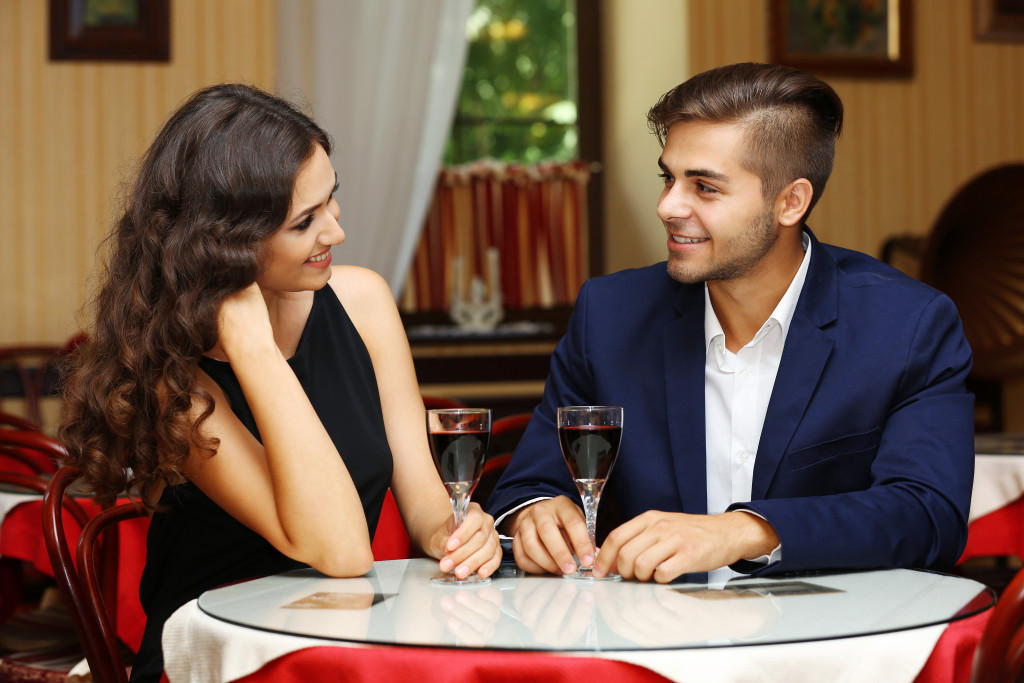 Young couple dating at a fancy restaurant