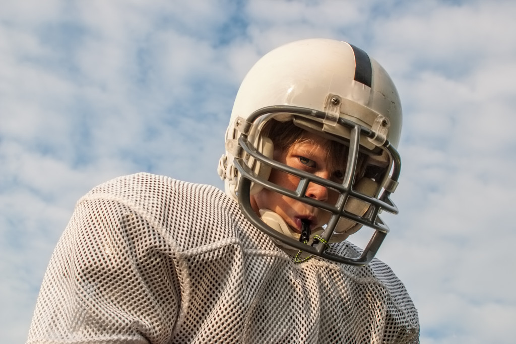 athlete wearing helmet and mouth piece