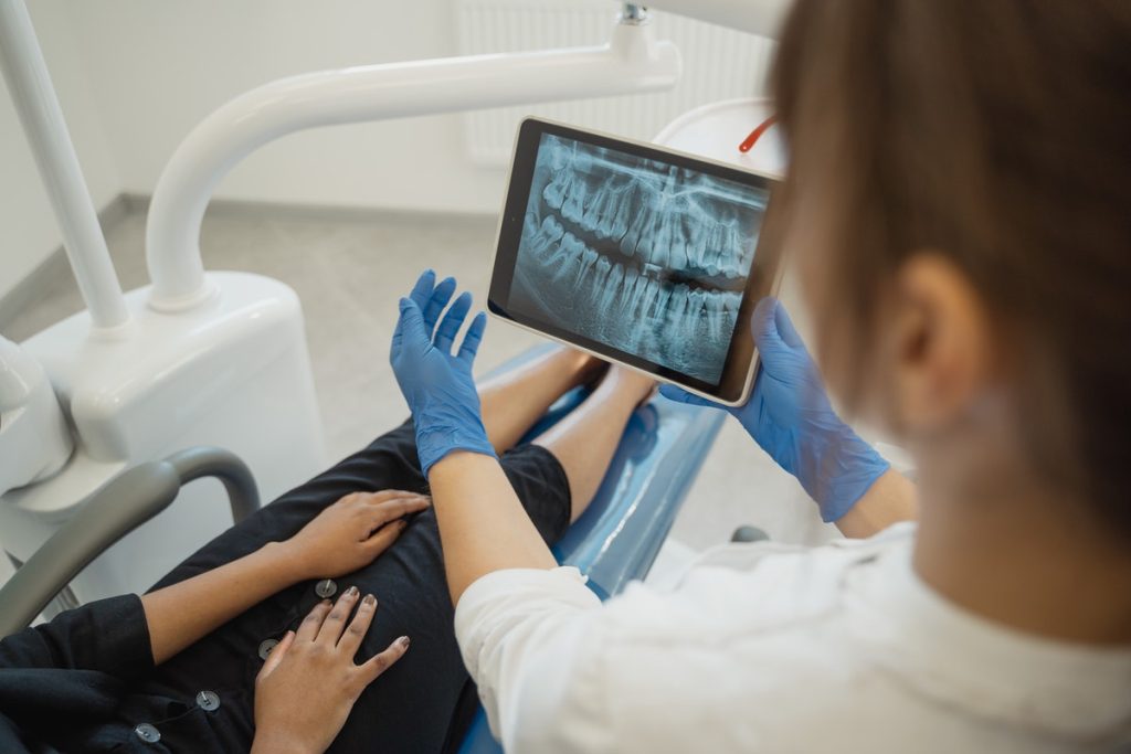 dentist showing an xray