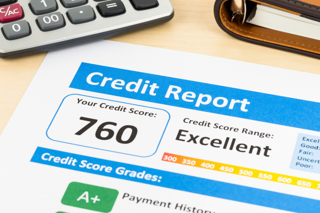 a credit score report document with calculator on the side