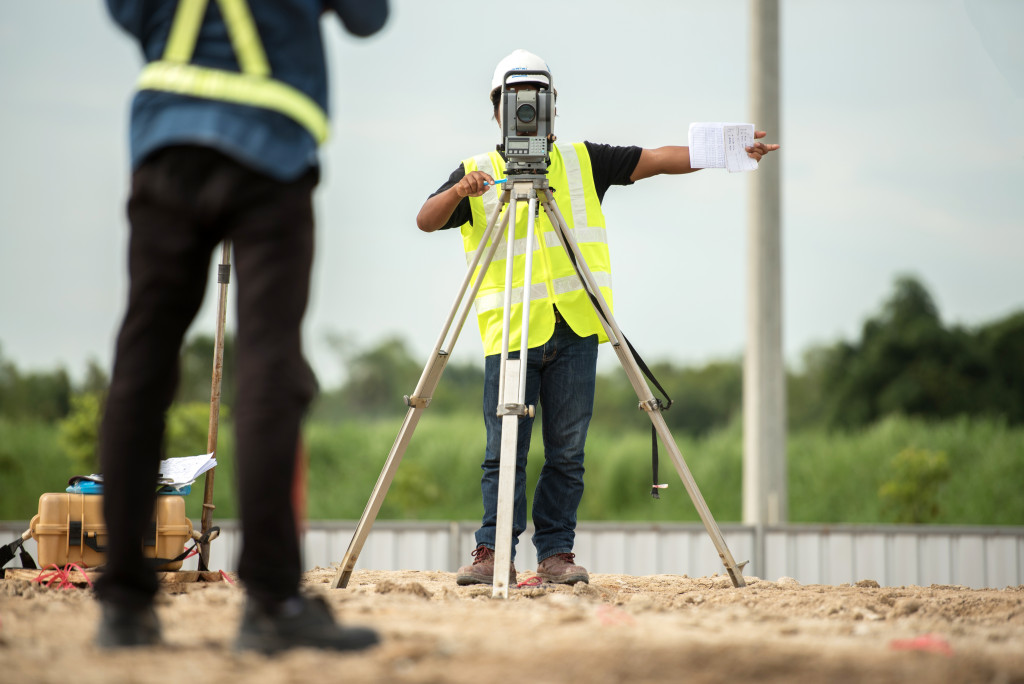 Surveyors using technology on a construction site