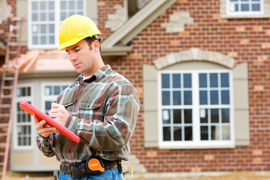 A home inspector looking into traditional house