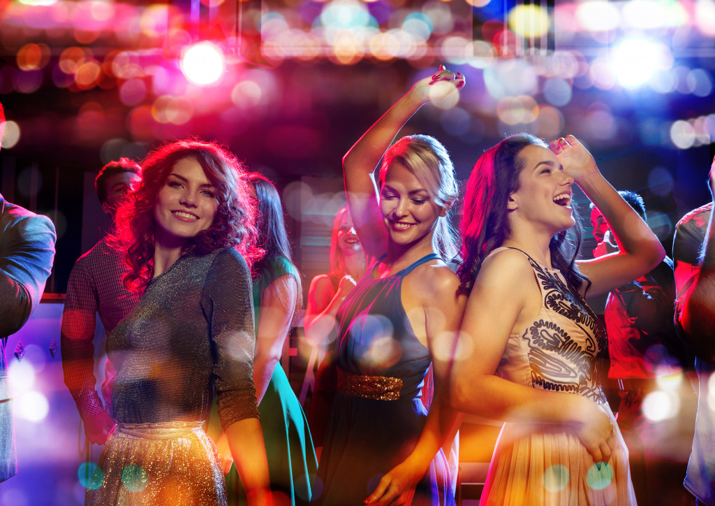 group of women dancing in club