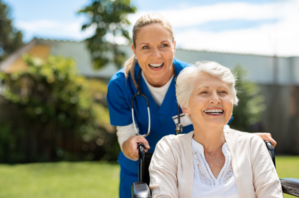 healthcare professional taking care of an elderly patient