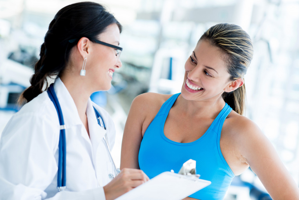 female athlete with her doctor