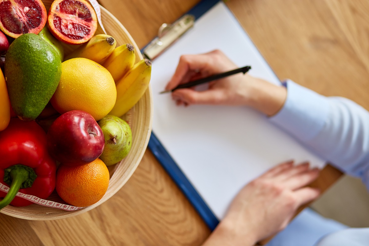 dietician writing a diet plan