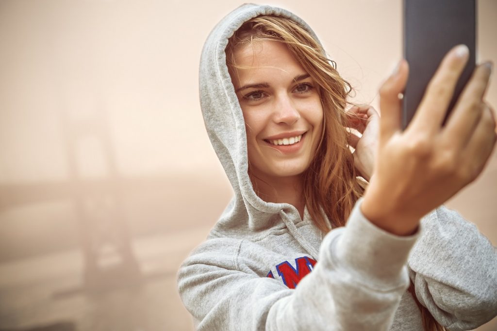 a woman taking a photo of herself