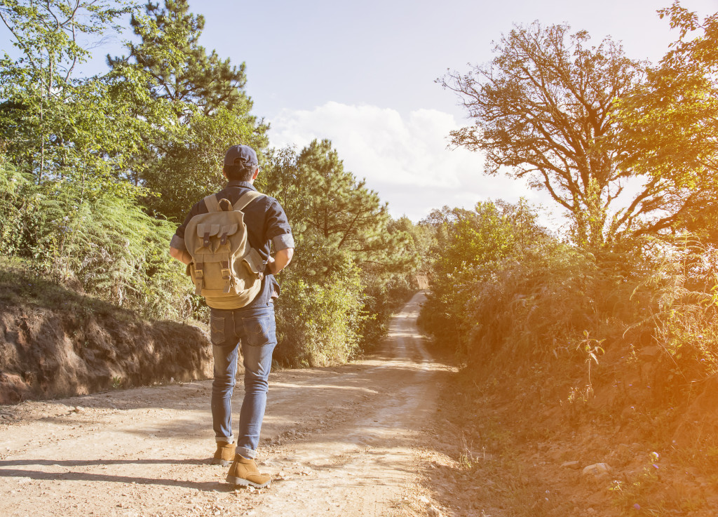 woman walking in a rough road