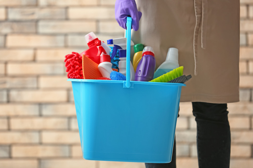 house cleaning tools in the bucket