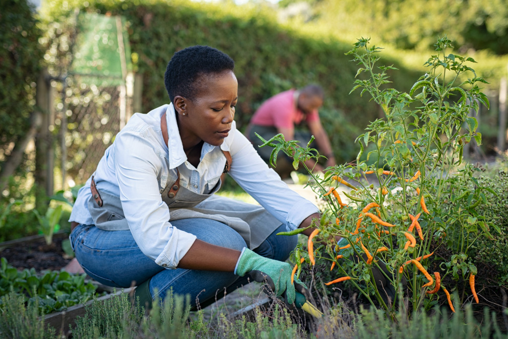 African woman gardening outdoors