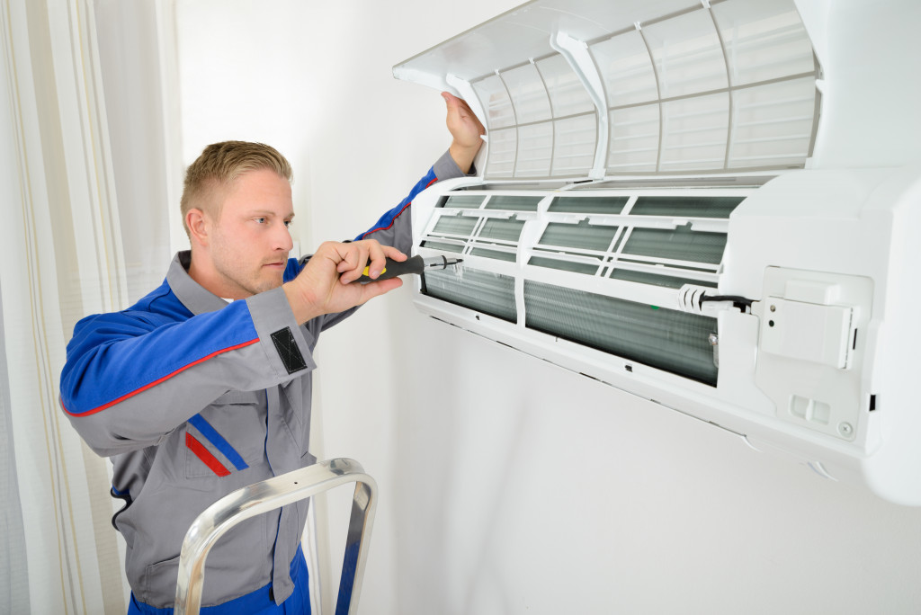 man Repairing Air Conditioner