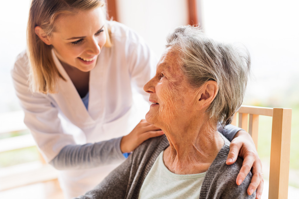 a smiling caregiver and patient