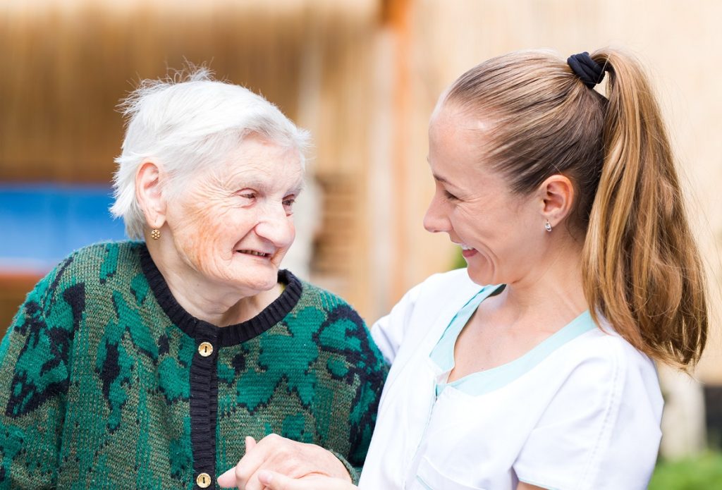 elderly woman and caregiver